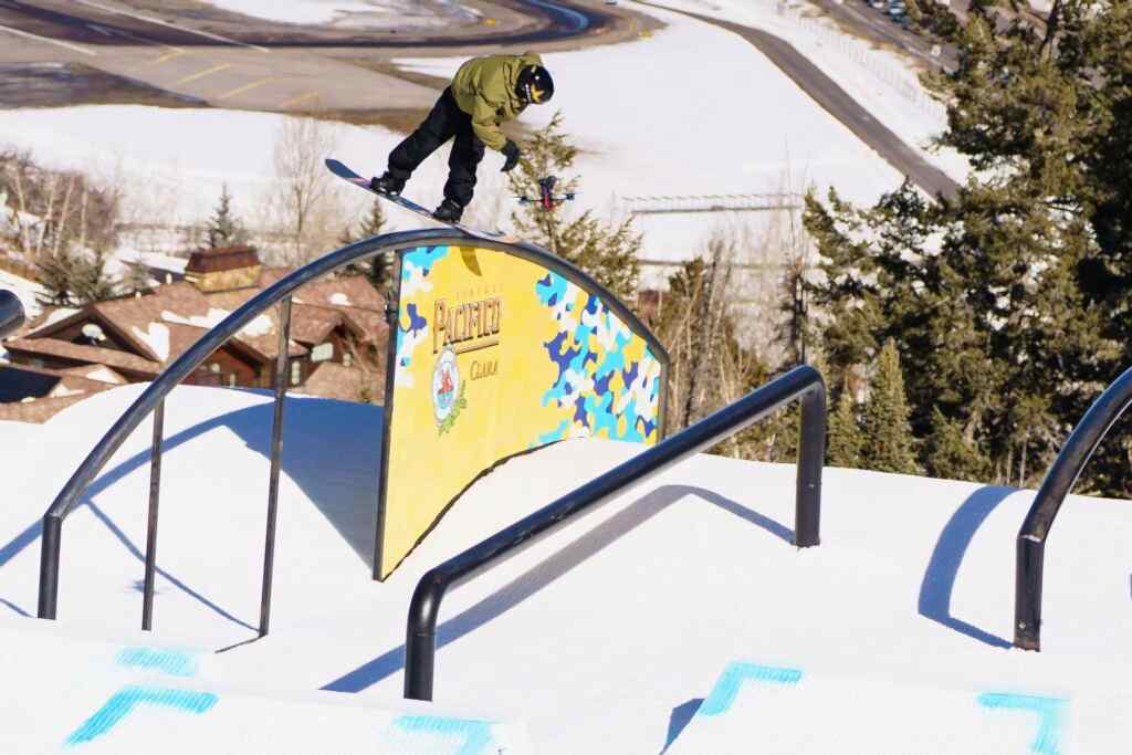 Red Gerard performing a rail grind at Aspen 2025 Slopestyle