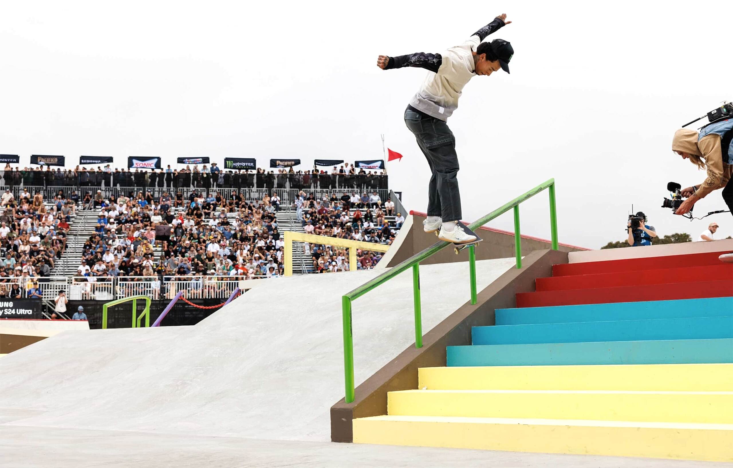 Nyjah Houston grinding down a ten-stair rail at the competition